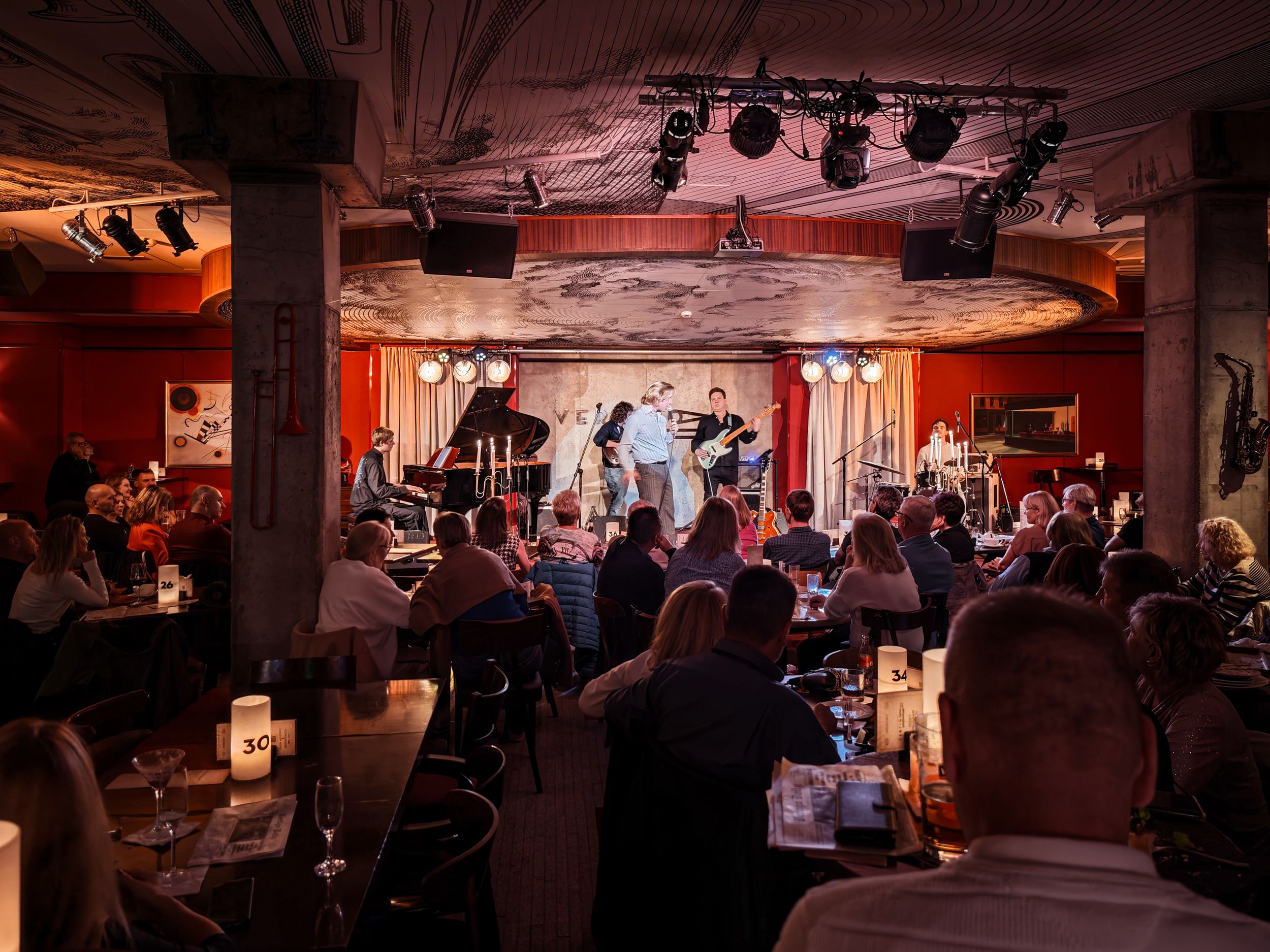 Vertigo Jazz Bar interior with ambient lighting and crowd of people, nightlife venue photography Wroclaw Poland
