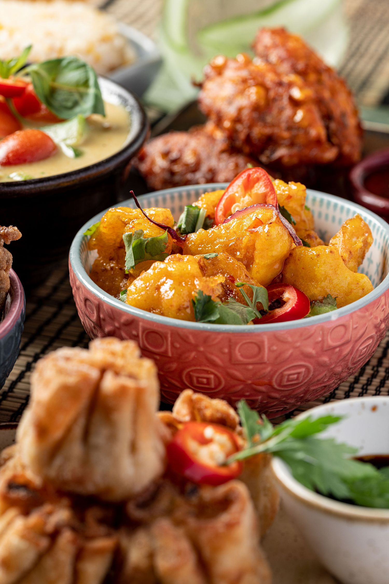 Crispy battered prawns with chilli, fried dumplings and fried chicken at Mango restaurant Southampton, Asian food photography