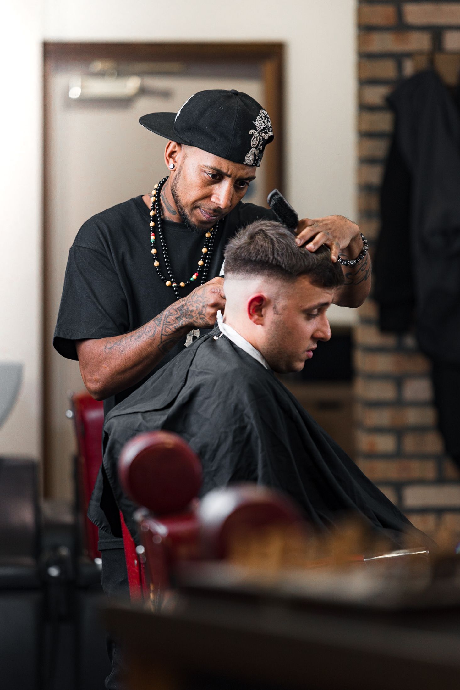 Barber brushing a client\