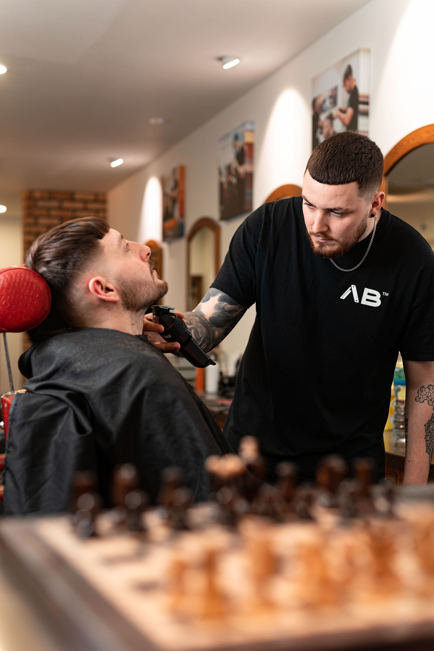 Barber trimming a client\