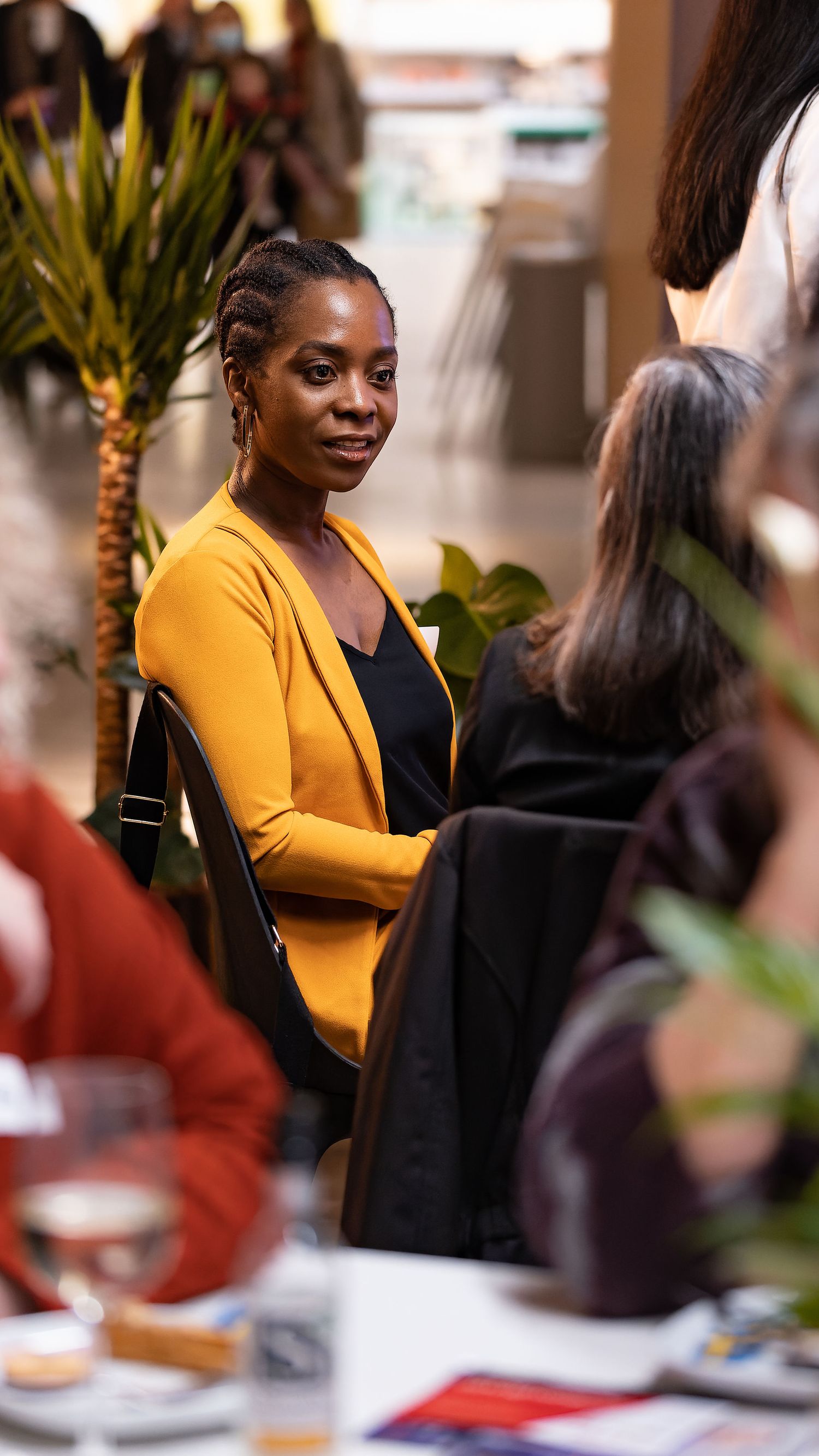 Professional woman in a yellow blazer at a city networking event Southampton, corporate lifestyle photography