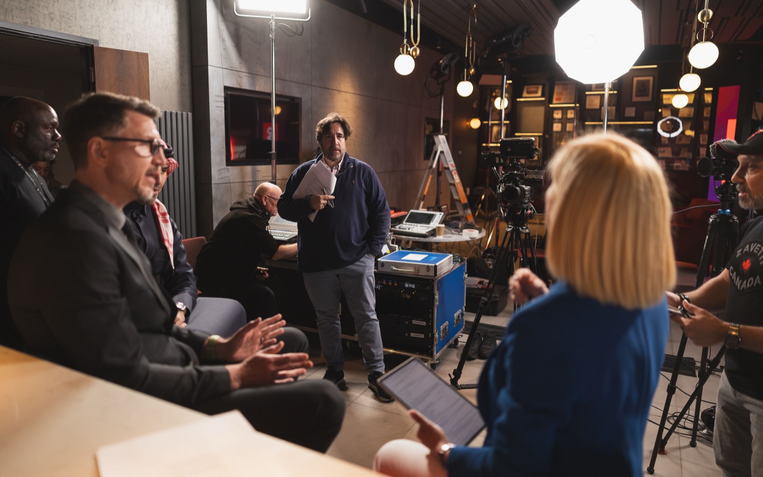 Behind-the-scenes interview setup with presenter and crew at St Marys Stadium Southampton for Lenovo, documentary production photography
