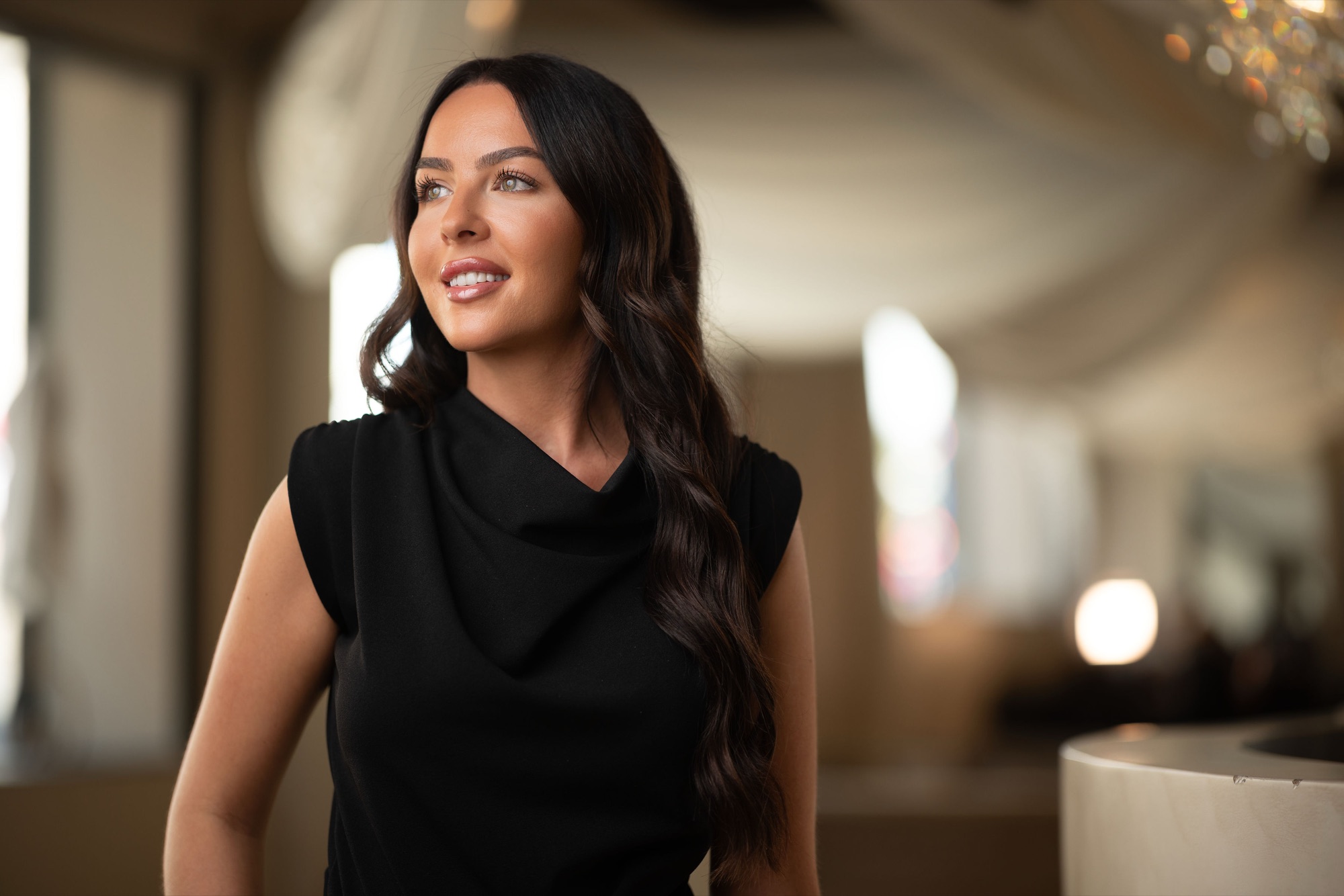 Warm, natural personal branding portrait of a staff member at Danica Payne on location, business photography