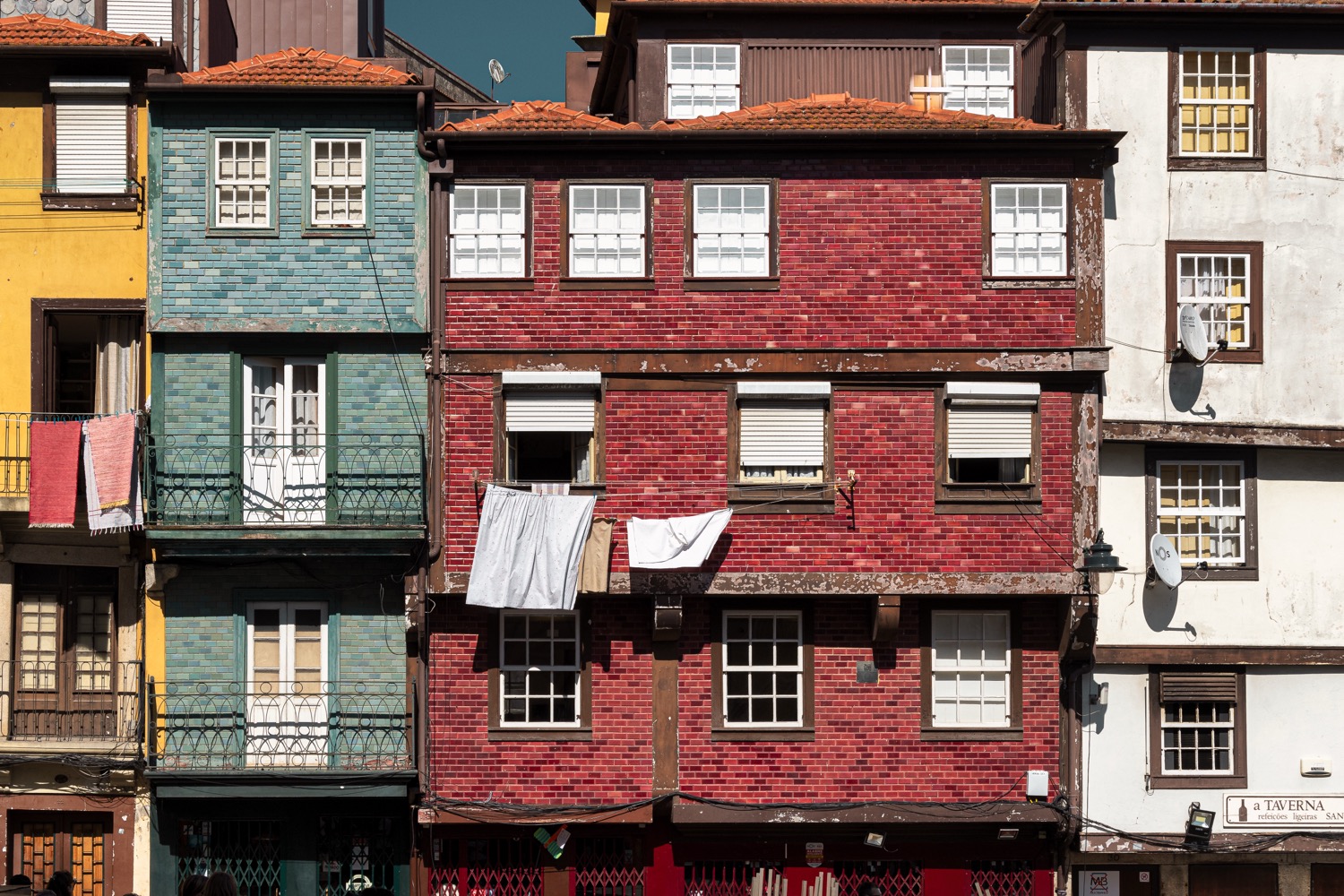 Colourful traditional facades with washing hung out, Ribeira district, Porto, Portugal, travel photography
