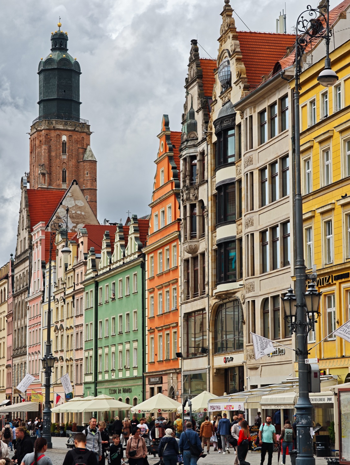 Coloured townhouses and cafe umbrellas in the market square, Wroclaw, Poland, travel photography