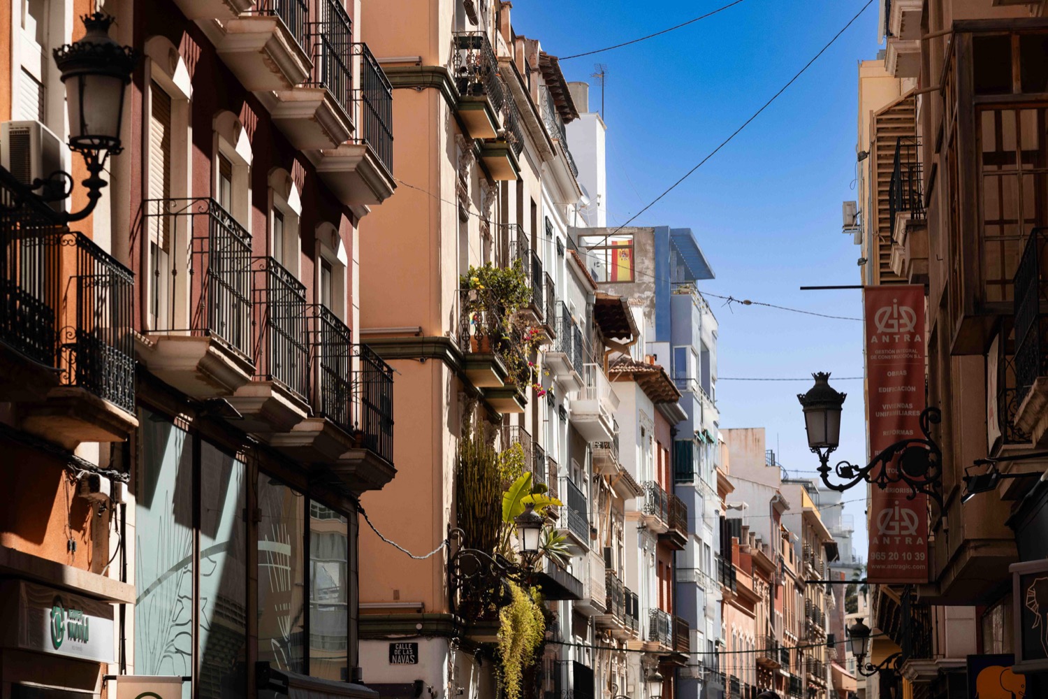 Narrow old-town street with wrought-iron balconies and shuttered windows, Alicante, Spain, travel photography