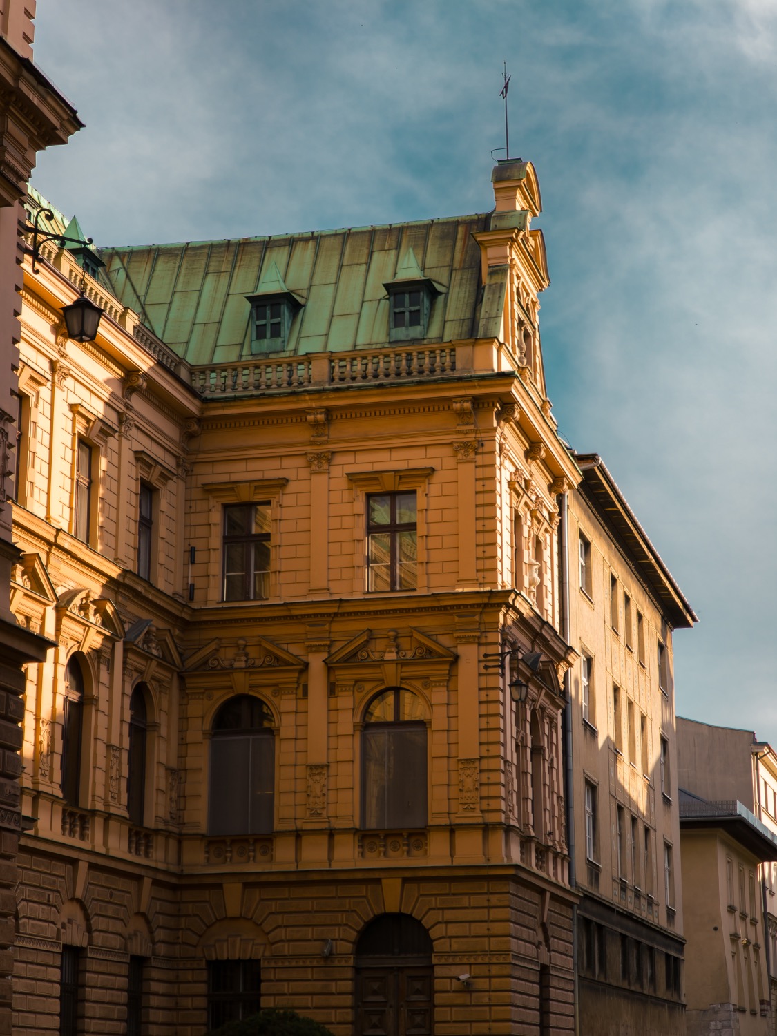 Ornate palace facade with a green copper roof, Wroclaw, Poland, travel photography